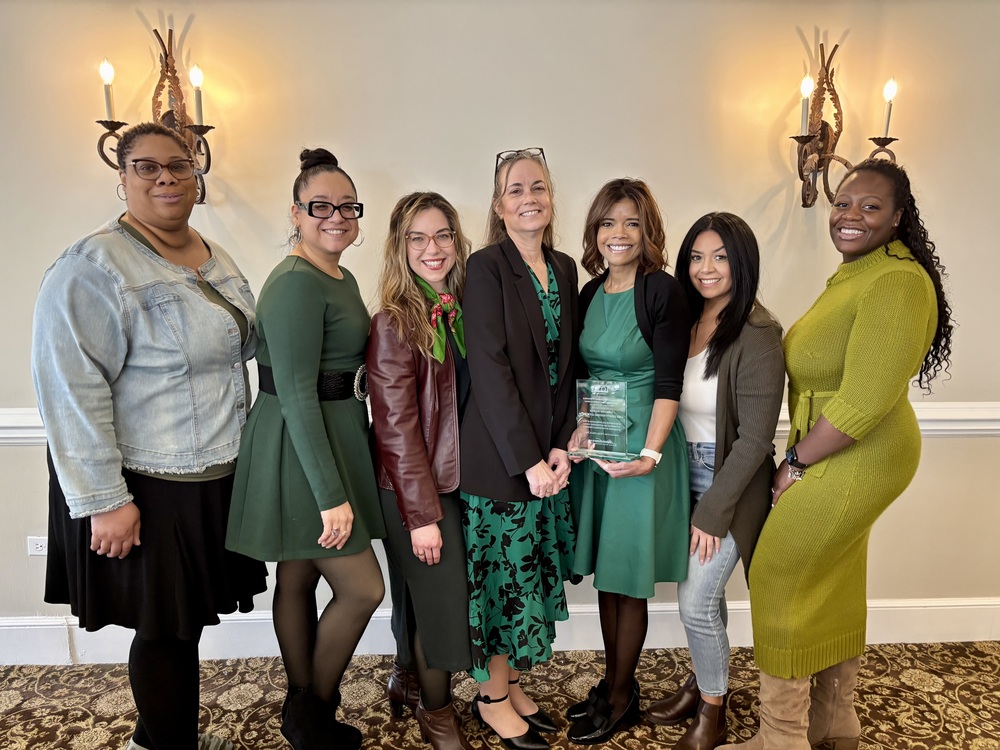 Six staff members with Lorraine Hocker