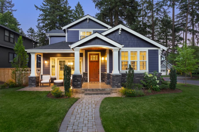 Blue House on Rolling green lawn